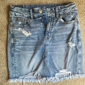 American Eagle ripped Jean skirt thumbnail 1