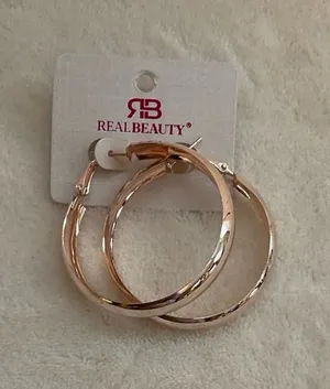 Rose Gold Twisted Hoop Earrings thumbnail 1