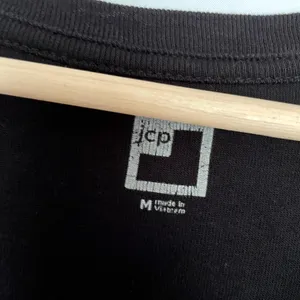 JCPenney black short sleeved shirt v-neck top women's size medium cotton basic thumbnail 3