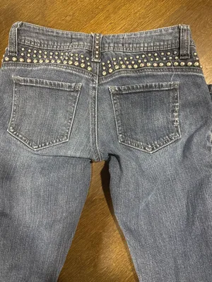 Bebe Women's Studded Skinny Jeans in Blue thumbnail 1