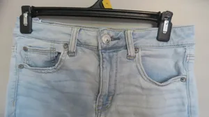 American Eagle Outfitters next level stretch hi-rise shortie jeans in light wash blue size 6. thumbnail 2