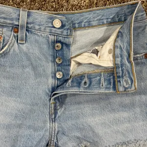 Vintage Levi's 501 light wash distressed jeans. Waist 27 (2" inseam) thumbnail 3
