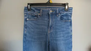 American Eagle Outfitters next level stretch super hi-rise flare jeans in medium wash blue size 4. thumbnail 5
