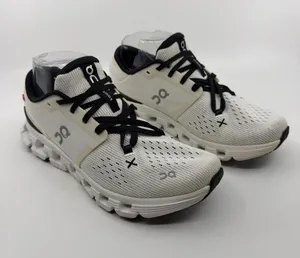 On Cloud X 4 sneakers in ivory and black colorway SZ 7.5 thumbnail 1