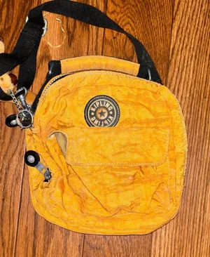 vintage 90s Kipling Private Transport 3-in-1 convertible bag in an ochre yellow thumbnail 1
