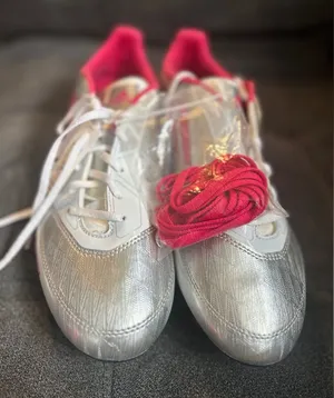Adidas F10 TRX FG W women's soccer cleats in the silver and pink colorway thumbnail 1