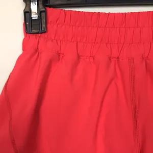 Lululemon Women’s Track That Mid Rise Coral Red Lined Athletic Workout Shorts thumbnail 2
