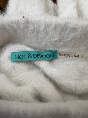 Fuzzy knit skirt in a soft white tone. Plush, textured fabric. Stretchy fit for comfort. Easy to style for layered looks or solo wear. Size small. hot & delicious thumbnail 4