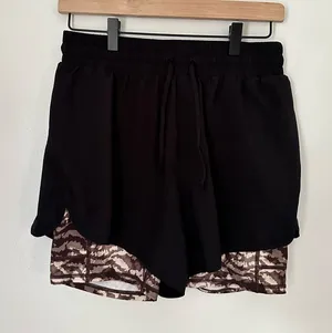 Fabletics Black Sloan Running Short| Women Athletic Shorts | Small thumbnail 1