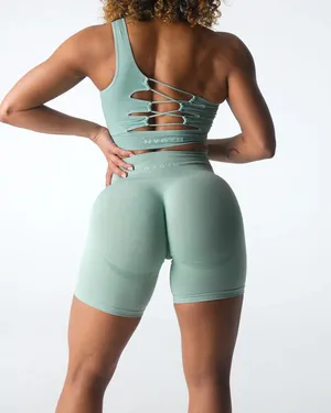 NVGTN Sage Green Contour Seamless Shorts M bike shorts lightly worn Our signature seamless material is now available in shorts! These shorts feature a conservative length that won’t be interrupted through movement along with a form flattering waistband that offers slight compression. This buttery soft and breathable material will not only feel weightless on your body, but will move with and not against you. Pair these with its matching seamless top or bra to complete the look. - Nylon and spandex - Fabric feels… lightweight, soft, stretchy - High waisted - Compressive waistband contour shaping thumbnail 2