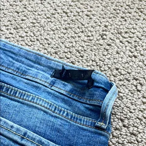 Denizen from Levi's Distressed Blue Low Rise Jeans thumbnail 11