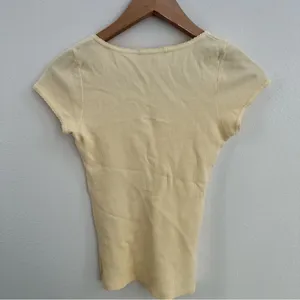 yellow Brandy Melville tee with a cute criss-cross detail thumbnail 4