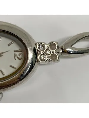 Silver tone women’s quartz analog watch 19mm oval white dial rhinestones running thumbnail 3