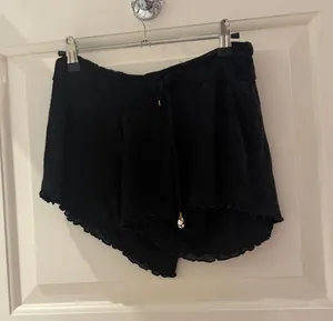 Women’s Black Shorts with Ruffle Hem and Drawstring thumbnail 1