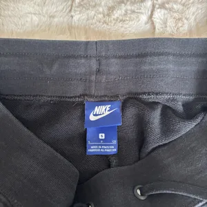 Black Nike sweatpants with drawstring waist and adjustable cuffs thumbnail 5