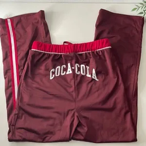 Coca-Cola silky soft sweatpants. Size Small. Drawstring waist. Pockets at waist. thumbnail 1