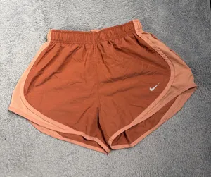Nike Women's Rust Orange Running Shorts small thumbnail 1
