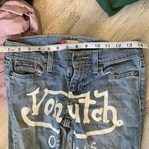 hand painted logo graphic jeans thumbnail 3