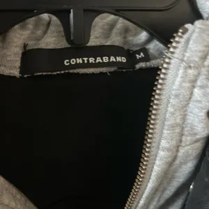 Contraband Black Distressed Denim Jacket w attached gray hoodie medium thumbnail 5