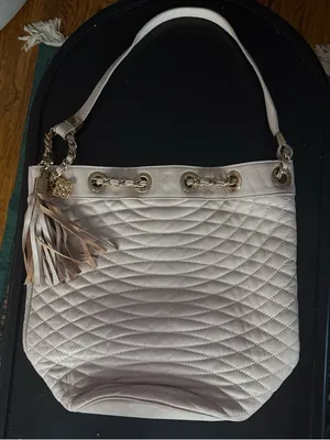 BCBGMaxAzria Quilted Tassel Shoulder Bag in Light Cream thumbnail 1