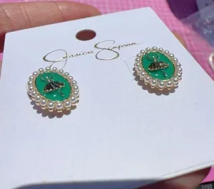 Jessica Simpson Earrings gold tone pearls around green ballerina stubs thumbnail 1