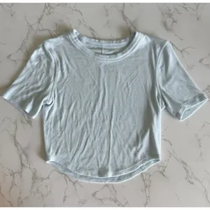 Lululemon Hold Tight Cropped Short Sleeve Ribbed TShirt ~4 Light Blue Curved Hem thumbnail 3