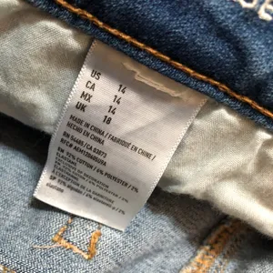 American Eagle Outfitters Super Stretch High-Rise Distressed Shortie thumbnail 7