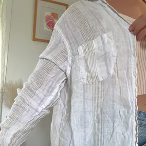 White linen button up shirt with ruffle collar and long sleeves #linen #summer thumbnail 2
