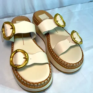 Dolce Vita size 7 women’s cream sandals w/gold buckles. New thumbnail 1
