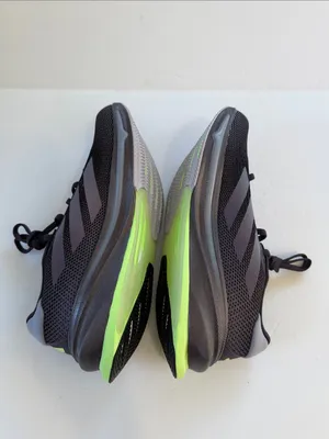 adidas women’s Black Athletic Shoes with White Stripes and Neon Green Accent thumbnail 9