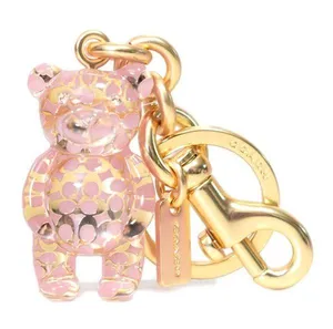 Coach Resin Gummy Bear Bag Charm Gold and Pink. Perfect for Coach Collectors! thumbnail 1
