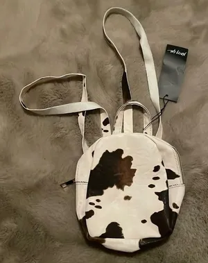 MOVING SALE!! NWT Cow print mini backpack! thumbnail 1