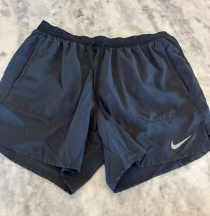 Nike Women's Athletic Shorts in Navy with Silver Swoosh thumbnail 1