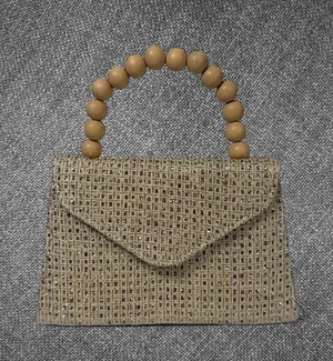 Metallic Gold Woven Envelope Handbag With Wooden Bead Handle And Chain Strap thumbnail 1