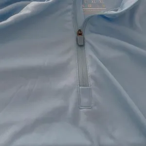 Baby blue long sleeve quarter zip athletic top in a women's size Large thumbnail 3