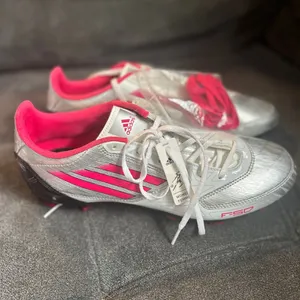 Adidas F10 TRX FG W women's soccer cleats in the silver and pink colorway thumbnail 4