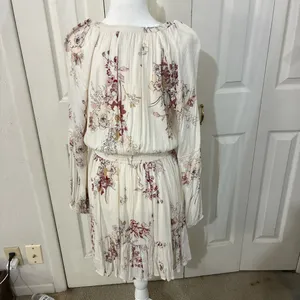 The American Rag Long Sleeve Lace Up Bodice Floral Dress in Cream is a stylish and versatile option for women. This fit & flare dress features a floral pattern in cream, pink, and white, making it perfect for various occasions such as travel, weddings, parties, or casual outings. The long sleeves and lace-up bodice add a touch of elegance, while the short dress length adds a trendy flair. Made from a blend of rayon, cotton, polyester, and linen, this dress offers both comfort and style for women in size M. thumbnail 4