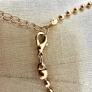 Gold tone sun pendant necklace thumbnail 6