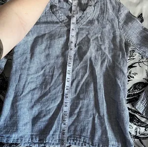 “The Tunic Shirt” from Old Navy in a soft, cool-toned gray thumbnail 4