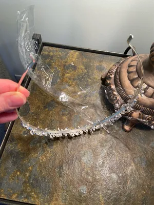 Silver metal headband with flowers and rhinestones on a vine thumbnail 5