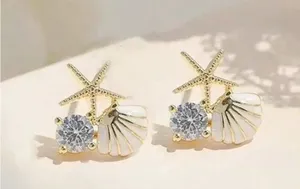 Gold and White Starfish Shell Earrings thumbnail 1