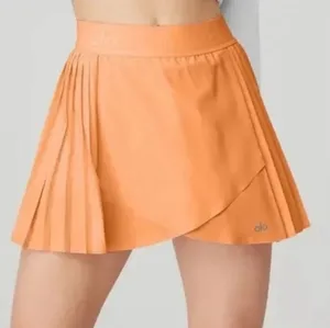 Alo Yoga Aces Tennis Skirt In Cantaloupe thumbnail 1