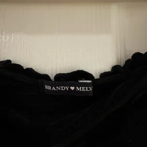 Brandy Melville black off-the-shoulder smocked crop top thumbnail 2