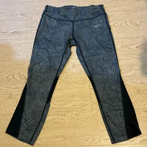 Nike Dri-FIT Capri running leggings with a black and gray geometric print and me thumbnail 1