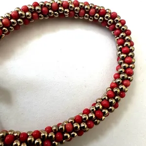 Gold tone and orange beaded stretchy cross bracelet thumbnail 4