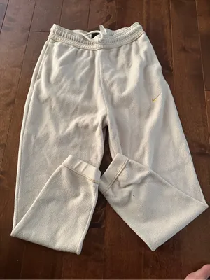 Nike Woman’s size Med Cream Sweatpants with Gold Swoosh Accent thumbnail 1