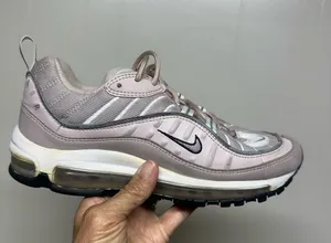 Nike Women's Sneakers in Pale Pink and Black Swoosh thumbnail 1