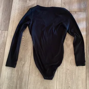 Stunning Black Long Sleeve Low Cut American Apparel Bodysuit thumbnail 3