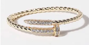 Pave Edge Twisted Gold Plated Bangle Bracelet thumbnail 1