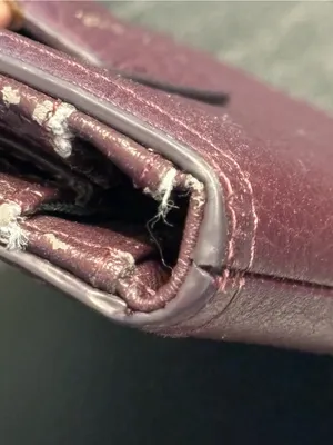 Fossil pebbled leather tab clutch wallet in a deep burgundy or berry color thumbnail 3